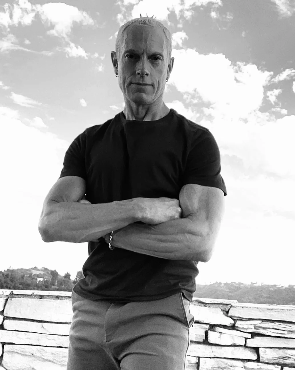 Rick Scott outdoors, arms crossed