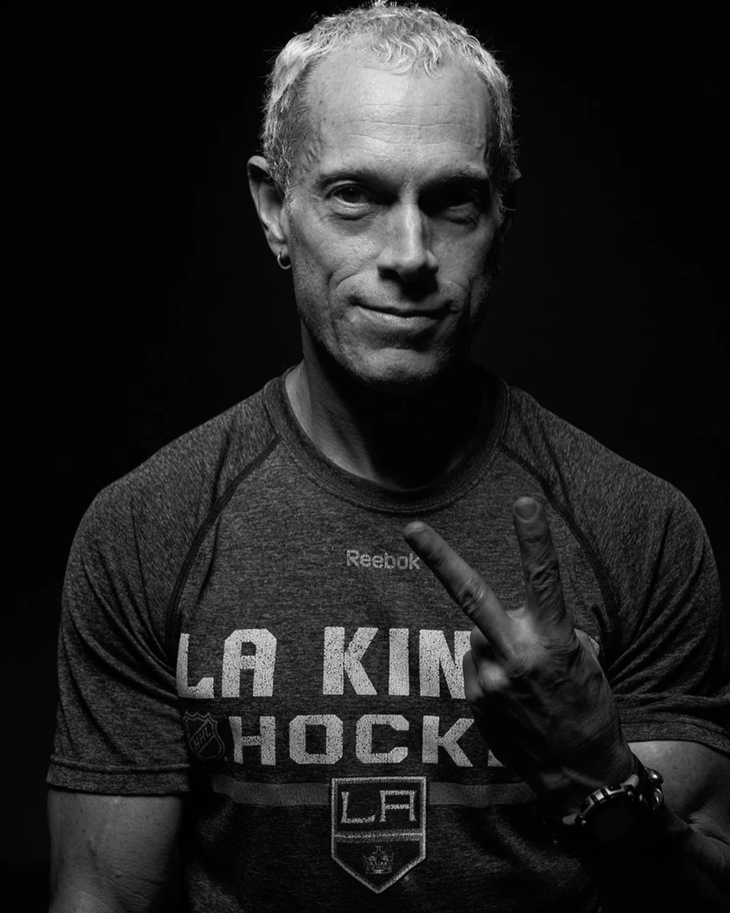 Rick Scott, black and white studio portrait in an LA Kings Hockey shirt